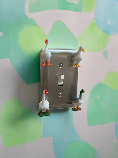 light switch with decorative duck magnets 